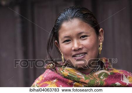 Stock Image - "Young Nepali woman with earrings, portrait, Bhaktapur, Nepal, Asia". Fotosearch