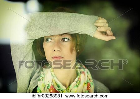 "Young pensive woman looking through a window, Grevenbroich, Rhineland, North Rhine-Westphalia, Germany, Europe" View Large Photo Image Stock Image - "Young pensive woman looking through a window, Grevenbroich, Rhineland, North Rhine-Westphalia, Germany, Europe". Fotosearch