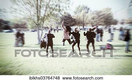 "Young people jumping in the air for a snapshot, Berlin, Germany, Europe" View Large Photo Image Stock Photo - "Young people jumping in the air for a snapshot, Berlin, Germany, Europe". Fotosearch