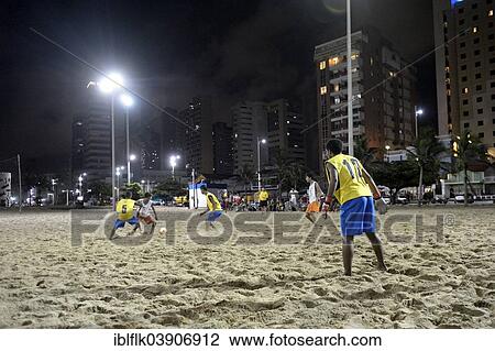 "Young people playing football in the evening at the beach, Praia de Iracema, Fortaleza, Ceara, Brazil, South America" View Large Photo Image Stock Image - "Young people playing football in the evening at the beach, Praia de Iracema, Fortaleza, Ceara, Brazil, South America". Fotosearch