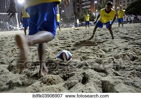 "Young people playing football in the evening at the beach, Praia de Iracema, Fortaleza, Ceara, Brazil, South America" View Large Photo Image Stock Photo - "Young people playing football in the evening at the beach, Praia de Iracema, Fortaleza, Ceara, Brazil, South America". Fotosearch