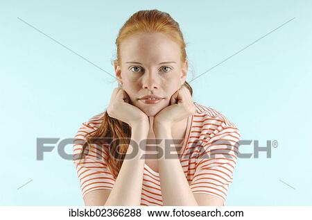 Stock Photo - "Young red-haired woman, portrait". Fotosearch