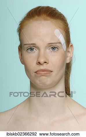 "Young red-haired woman with a plaster, portrait" View Large Photo Image Stock Image - "Young red-haired woman with a plaster, portrait". Fotosearch