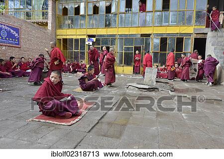 "Young Tibetan novice monks in red robes, students at a Buddhist monastery, Tongren Monastery, Repkong, Qinghai, formerly Amdo, Tibet, China, Asia" View Large Photo Image Stock Image - "Young Tibetan novice monks in red robes, students at a Buddhist monastery, Tongren Monastery, Repkong, Qinghai, formerly Amdo, Tibet, China, Asia". Fotosearch