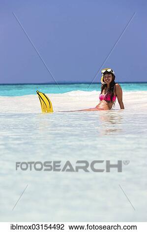 "Young woman, about 20, sitting on a sandbank with snorkeling gear, Indian Ocean, Male, North Male Atoll, Maldives, Asia" View Large Photo Image Stock Image - "Young woman, about 20, sitting on a sandbank with snorkeling gear, Indian Ocean, Male, North Male Atoll, Maldives, Asia". Fotosearch