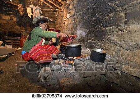 "Young woman cooking on an open fire in her traditional kitchen, Union Potrero, Quispillacta, Ayacucho, Peru, South America" View Large Photo Image Picture - "Young woman cooking on an open fire in her traditional kitchen, Union Potrero, Quispillacta, Ayacucho, Peru, South America". Fotosearch