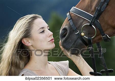 "Young woman cuddling with an Oldenburger horse, bay, North Tyrol, Austria, Europe" View Large Photo Image Stock Image - "Young woman cuddling with an Oldenburger horse, bay, North Tyrol, Austria, Europe". Fotosearch