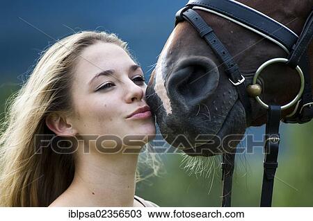 "Young woman cuddling with an Oldenburger horse, bay, North Tyrol, Austria, Europe" View Large Photo Image Stock Image - "Young woman cuddling with an Oldenburger horse, bay, North Tyrol, Austria, Europe". Fotosearch