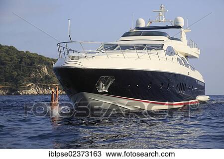 "Young woman diving from the deck of a yacht, Leonardo II, a cruiser built by Azimut, type of boat: Leonardo 98, length: 30. 15 m, built in 2004, French Riviera, France, Mediterranean Sea, Europe" View Large Photo Image Stock Image - "Young woman diving from the deck of a yacht, Leonardo II, a cruiser built by Azimut, type of boat: Leonardo 98, length: 30. 15 m, built in 2004, French Riviera, France, Mediterranean Sea, Europe". Fotosearch