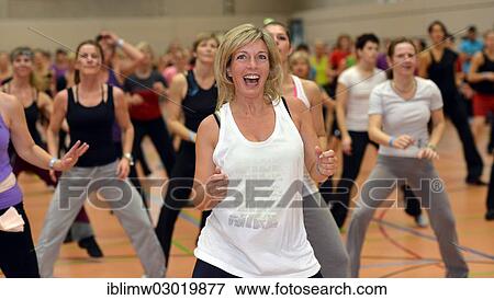 Stock Photo - "Young woman doing aerobics, Haus des Sports venue, Stuttgart, Baden-Wurttemberg, Germany, Europe". Fotosearch