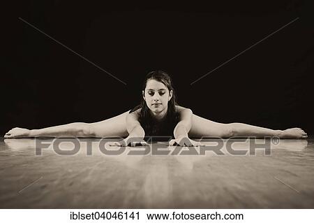 "Young woman doing the splits, acrobatics" View Large Photo Image Stock Image - "Young woman doing the splits, acrobatics". Fotosearch