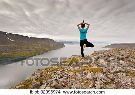 "Young woman doing yoga, Hornstrandir, West Iceland, Iceland, Europe" View Large Photo Image Picture - "Young woman doing yoga, Hornstrandir, West Iceland, Iceland, Europe". Fotosearch