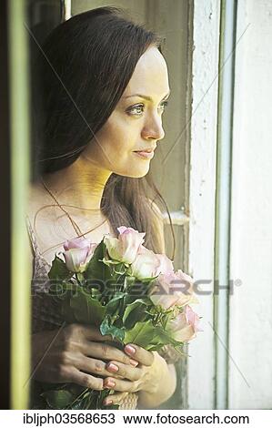 "Young woman holding a bunch of roses, Germany, Europe" View Large Photo Image Stock Image - "Young woman holding a bunch of roses, Germany, Europe". Fotosearch