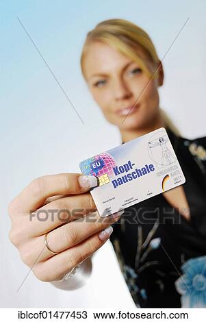 "Young woman holding insurance card, Kopfpauschale, capitation fee, written on it" View Large Photo Image Stock Image - "Young woman holding insurance card, Kopfpauschale, capitation fee, written on it". Fotosearch