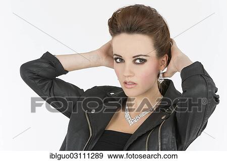 Young woman in a black leather outfit View Large Photo Image Stock Photo - Young woman in a black leather outfit. Fotosearch