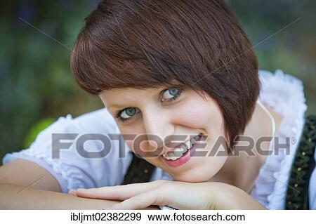 Stock Photo - "Young woman in a dirndl, portrait". Fotosearch