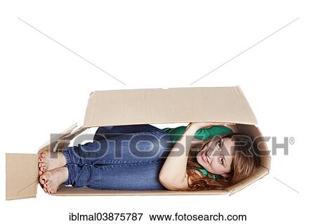 Young woman in a moving box View Large Photo Image Stock Photo - Young woman in a moving box. Fotosearch