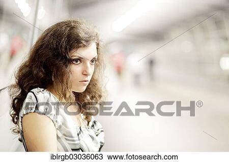 Stock Image - "Young woman in a public space, Allgaeu, Kempten, Allgau, Swabia, Bavaria, Germany, Europe". Fotosearch