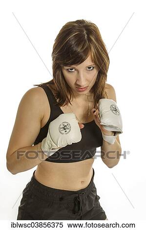 "Young woman in sportswear wearing Wing Chun gloves, in a fighting stance" View Large Photo Image Stock Photography - "Young woman in sportswear wearing Wing Chun gloves, in a fighting stance". Fotosearch