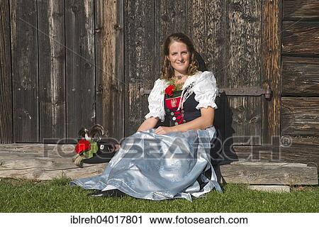 "Young woman in traditional costume, Tyrolean traditional costume typical for the region Achensee, Pertisau am Achensee, Tyrol, Austria, Europe" View Large Photo Image Stock Image - "Young woman in traditional costume, Tyrolean traditional costume typical for the region Achensee, Pertisau am Achensee, Tyrol, Austria, Europe". Fotosearch