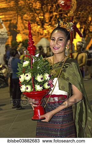 Stock Image - "Young woman in traditional costume, parade, Loi Krathong Festival of Lights, Loy, Chiang Mai, Northern Thailand, Thailand, Asia". Fotosearch