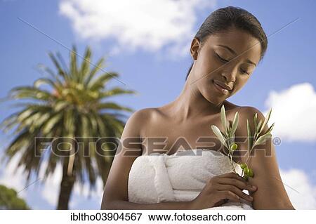 Young woman is enjoying a wellness and spa day View Large Photo Image Stock Photo - Young woman is enjoying a wellness and spa day. Fotosearch
