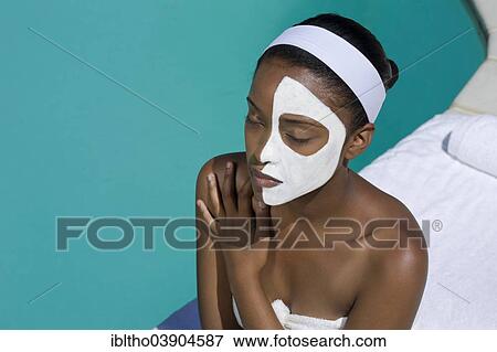 Stock Photo - Young woman is enjoying a wellness and spa day. Fotosearch