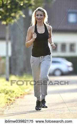 Stock Photography - "Young woman jogging, Germany, Europe". Fotosearch