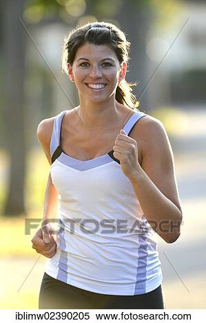 Stock Photography - "Young woman jogging, Stuttgart, Baden-Wuerttemberg, Germany, Europe, PublicGround, Europe". Fotosearch