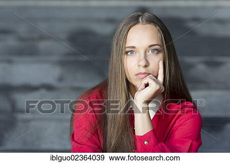"Young woman looking pensive, portrait" View Large Photo Image Stock Photo - "Young woman looking pensive, portrait". Fotosearch