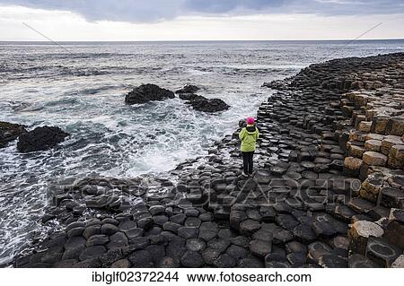 "Young woman looking towards the sea, basalt rocks, Giant Causeway, Coleraine, Northern Ireland, United Kingdom, Europe" View Large Photo Image Picture - "Young woman looking towards the sea, basalt rocks, Giant Causeway, Coleraine, Northern Ireland, United Kingdom, Europe". Fotosearch