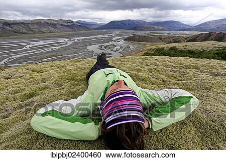 "Young woman lying in a moss landscape, Sandur of Vatnajoekull, Iceland, Europe" View Large Photo Image Stock Image - "Young woman lying in a moss landscape, Sandur of Vatnajoekull, Iceland, Europe". Fotosearch