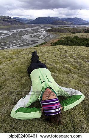 "Young woman lying in a moss landscape, Sandur of Vatnajoekull, Iceland, Europe" View Large Photo Image Stock Image - "Young woman lying in a moss landscape, Sandur of Vatnajoekull, Iceland, Europe". Fotosearch