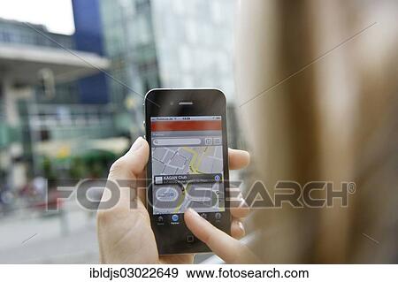 "Young woman navigating with a smartphone, Freiburg im Breisgau, Baden-Wurttemberg, Germany, Europe" View Large Photo Image Stock Photo - "Young woman navigating with a smartphone, Freiburg im Breisgau, Baden-Wurttemberg, Germany, Europe". Fotosearch