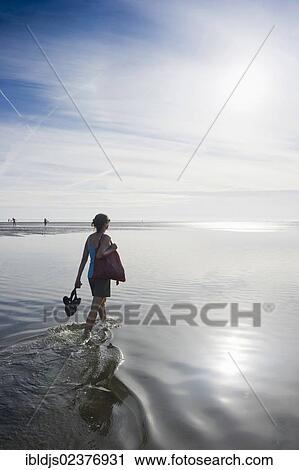 "Young woman on a Wadden Sea hiking tour, Wyk, Foehr island, North Frisia, Schleswig-Holstein, Germany, Europe" View Large Photo Image Stock Image - "Young woman on a Wadden Sea hiking tour, Wyk, Foehr island, North Frisia, Schleswig-Holstein, Germany, Europe". Fotosearch
