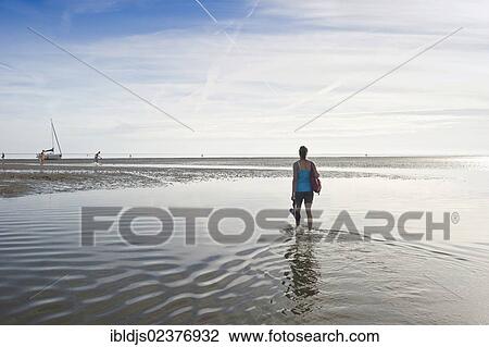 "Young woman on a Wadden Sea hiking tour, Wyk, Foehr island, North Frisia, Schleswig-Holstein, Germany, Europe" View Large Photo Image Stock Image - "Young woman on a Wadden Sea hiking tour, Wyk, Foehr island, North Frisia, Schleswig-Holstein, Germany, Europe". Fotosearch