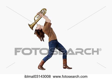 Young Woman playing the trumpet View Large Photo Image Stock Photo - Young Woman playing the trumpet. Fotosearch