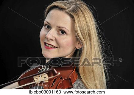 "Young woman playing the violin, Schwabisch Gmund, Ostalbkreis, Baden-Wurttemberg, Germany, Europe" View Large Photo Image Stock Image - "Young woman playing the violin, Schwabisch Gmund, Ostalbkreis, Baden-Wurttemberg, Germany, Europe". Fotosearch