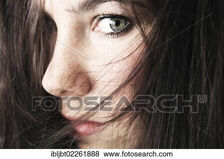Stock Photo - "Young woman, portrait, hair covering face". Fotosearch