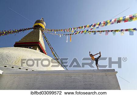 "Young woman practicing yoga at Boudnanath stupa, showing the Natarajasana pose, or Lord Shiva's pose, Kathmandu Valley, Kathmandu, Kathmandu District, Bagmati Zone, Nepal, Asia" View Large Photo Image Stock Image - "Young woman practicing yoga at Boudnanath stupa, showing the Natarajasana pose, or Lord Shiva's pose, Kathmandu Valley, Kathmandu, Kathmandu District, Bagmati Zone, Nepal, Asia". Fotosearch