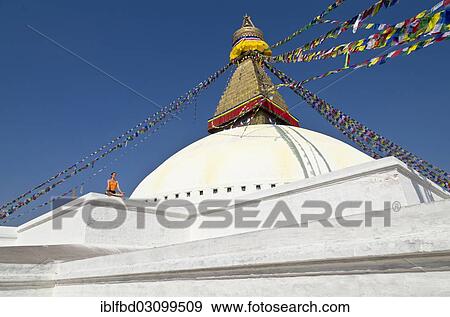 "Young woman practicing yoga at the Boudnanath stupa, showing the Padmasana pose, or Lotus pose, Kathmandu Valley, Kathmandu, Kathmandu District, Bagmati Zone, Nepal, Asia" View Large Photo Image Stock Photo - "Young woman practicing yoga at the Boudnanath stupa, showing the Padmasana pose, or Lotus pose, Kathmandu Valley, Kathmandu, Kathmandu District, Bagmati Zone, Nepal, Asia". Fotosearch