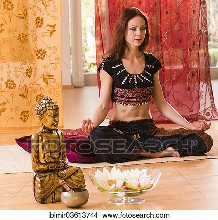 "Young woman practicing yoga, Germany, Europe" View Large Photo Image Picture - "Young woman practicing yoga, Germany, Europe". Fotosearch