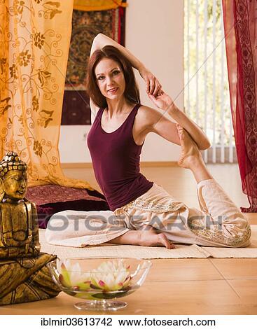Stock Image - "Young woman practicing yoga, Germany, Europe". Fotosearch