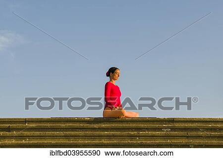 "Young woman practising Hatha yoga, outdoors, showing the pose Padmasana, Lotus pose" View Large Photo Image Stock Image - "Young woman practising Hatha yoga, outdoors, showing the pose Padmasana, Lotus pose". Fotosearch