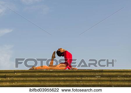 "Young woman practising Hatha yoga, outdoors, showing the pose Bhujangasana, Cobra pose" View Large Photo Image Stock Image - "Young woman practising Hatha yoga, outdoors, showing the pose Bhujangasana, Cobra pose". Fotosearch