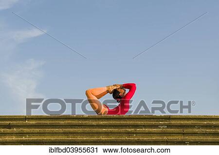 "Young woman practising Hatha yoga, outdoors, showing the pose Dhanurasana, Bow pose" View Large Photo Image Stock Image - "Young woman practising Hatha yoga, outdoors, showing the pose Dhanurasana, Bow pose". Fotosearch
