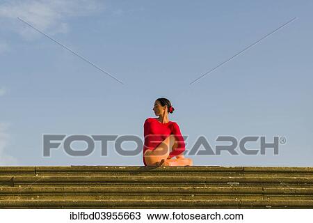 "Young woman practising Hatha yoga, outdoors, showing the pose Ardha Matsyendrasana, half spinal twist" View Large Photo Image Stock Image - "Young woman practising Hatha yoga, outdoors, showing the pose Ardha Matsyendrasana, half spinal twist". Fotosearch