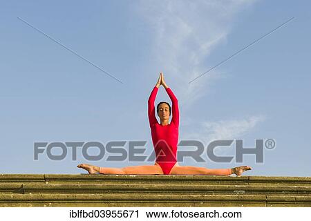 "Young woman practising Hatha yoga, outdoors, showing the pose Samakonasana, right angle pose, side split" View Large Photo Image Stock Image - "Young woman practising Hatha yoga, outdoors, showing the pose Samakonasana, right angle pose, side split". Fotosearch