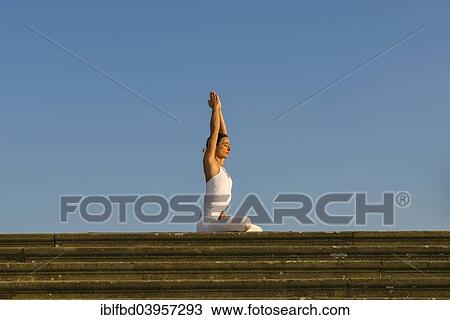 "Young woman practising Hatha yoga, outdoors, showing the pose Padmasana, Lotus pose" View Large Photo Image Stock Image - "Young woman practising Hatha yoga, outdoors, showing the pose Padmasana, Lotus pose". Fotosearch