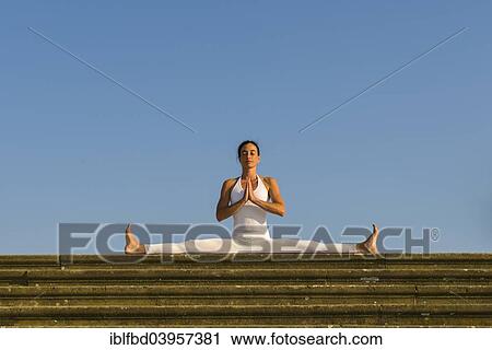 "Young woman practising Hatha yoga, outdoors, showing the pose Samakonasana, Right-angle pose, side split" View Large Photo Image Stock Image - "Young woman practising Hatha yoga, outdoors, showing the pose Samakonasana, Right-angle pose, side split". Fotosearch